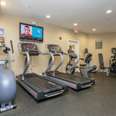 Fitness center cardio equipment and TVs