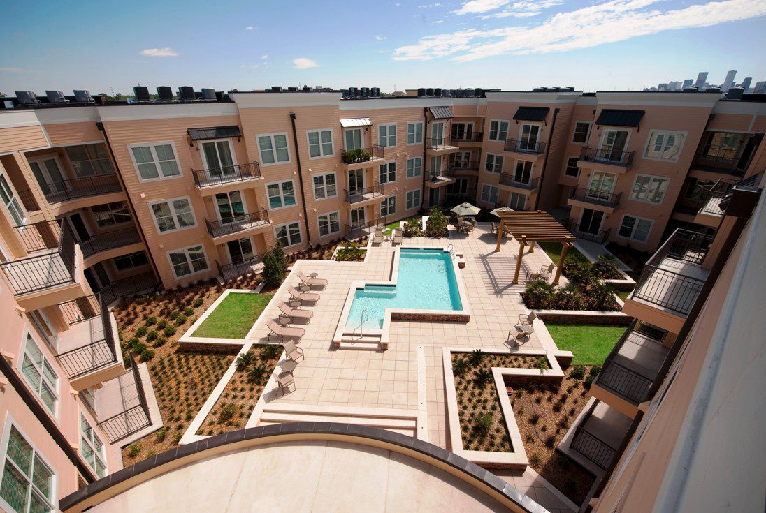 view of interior and landscaping with pool from apartment